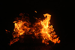 yellow and red flames on dark background