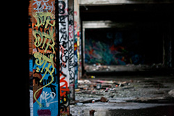 graffiti on pillars in industrial building