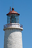 lighthouse tower and lantern on blue sky