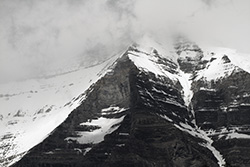 Mount-Robson, snow-capped with clouds, in British Columbia