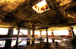 parking HDR with reflection in water and hole in ceiling