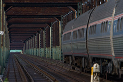 train in steel railway bridge with vanishing point