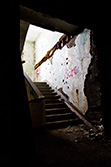 dark stairs with light from top in abandoned building