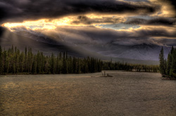 sunbeams at sunset on river in HDR photo, Athabasca, Alberta
